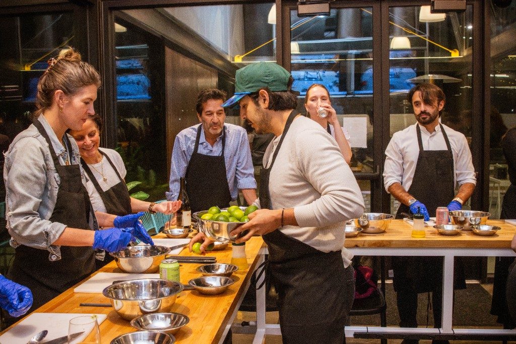 Guests cooking together at a class we announced in the newsletter
